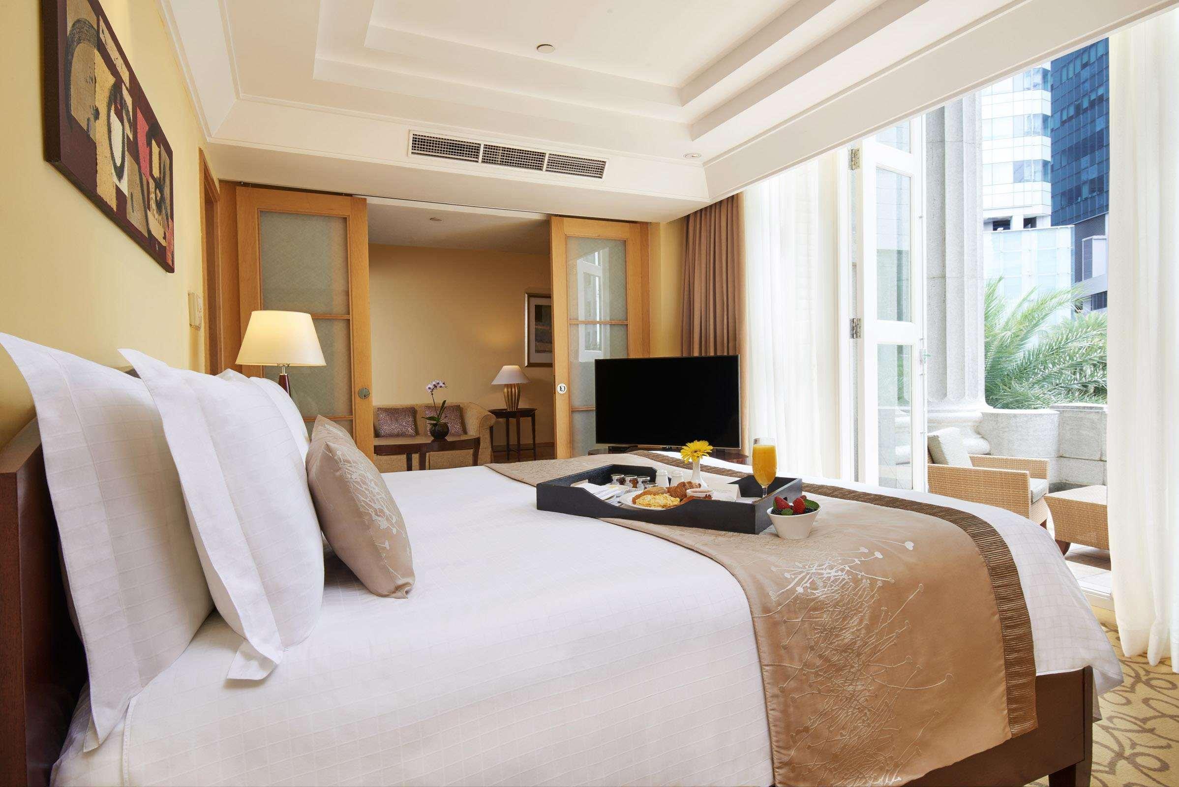 The Fullerton Hotel Сингапур Екстериор снимка A bedroom at the hotel